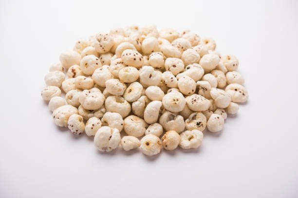 Makhana, also called as Lotus Seeds or Fox Nuts are popular dry snacks from India, served in a bowl. selective focus
