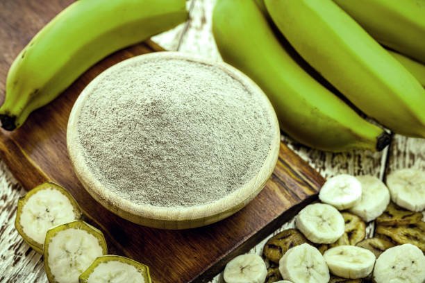 alternative flour, homemade green banana flour, with fried banana slices and chips around it