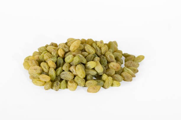 Pile of Green raisins on a white background